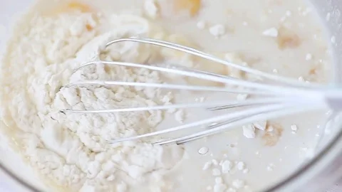 Whisking eggs and flour Stock Footage 81747925