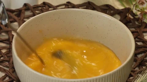 Whisking Eggs in Deep Ceramic Bowl with Kitchen Utensil Stock Footage 311318399