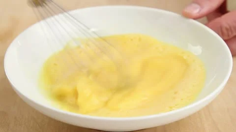 Whisking eggs Stock Footage 24651856