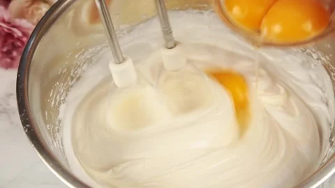 Whisking eggs Stock Footage 303439618