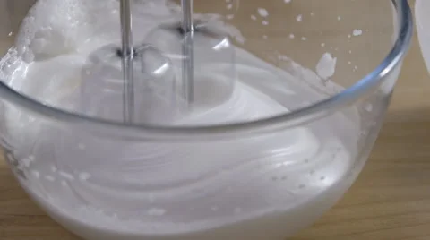 Whisking eggs to make meringue Stock Footage 63994963