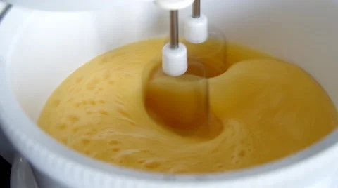 Whisking eggs in a mixer Stock Footage 49207466