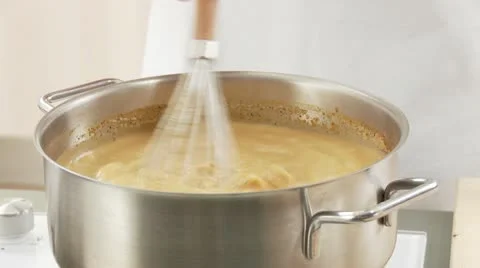 Whisking lobster sauce until smooth Stock Footage 24663717