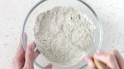 Whisking matcha powder and dry ingredients together Stock Footage 161345341