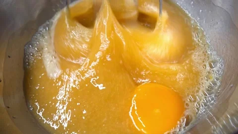 Whisking Process of Egg Yolks for Baking or Cooking Purposes Stock Footage 328113893