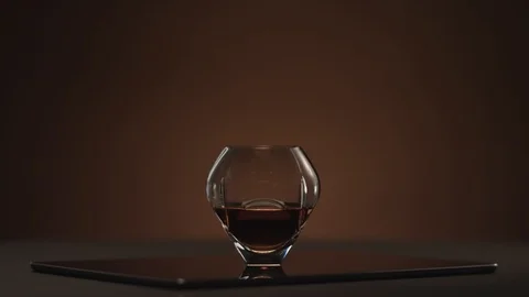 Whisky in a glass tumbler on a table Stock Footage 90755341