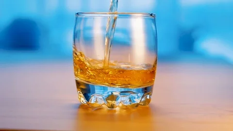 Whisky is poured into glass. Slow motion Stock Footage 124730153