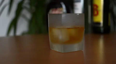 Whisky on the rocks pour HD Stock Footage 24280350