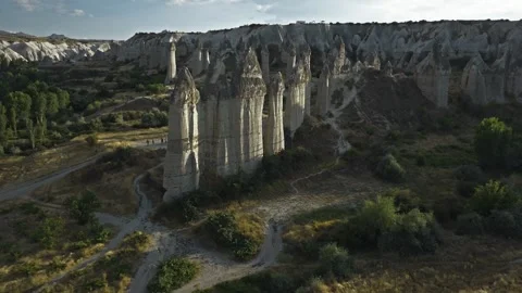 Whispering shadows over Cappadocia's stone sentinels, Turkey, aerial drone Stock Footage 346372966