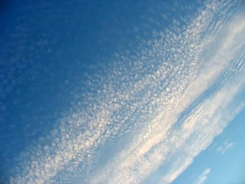 Whispy Blue Clouds Stock Photos
