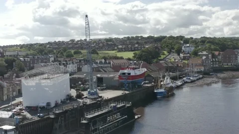 Whitby drone shot over River Esk with boatyard Stock Footage 239094577