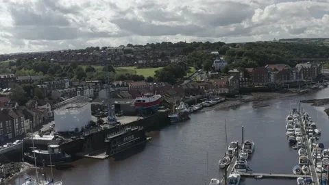 Whitby drone shot over River Esk approaching boatyard Stock Footage 239094994