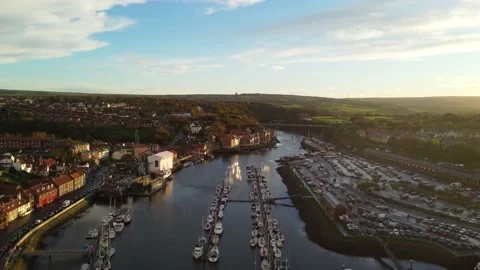 Whitby Harbour at Sunset by Drone Stock Footage 220960527