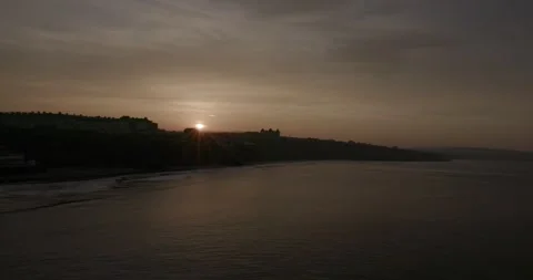 Whitby pier at sunset looking towards the town Stock Footage 240950707