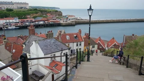 Whitby steps down to town on the North Yorkshire coast Stock Footage 197518202