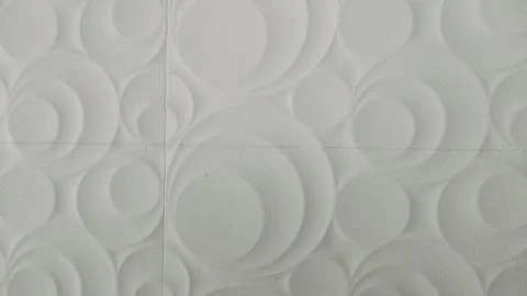 White 3D wall panel texture background with abstract circle pattern Foto stock
