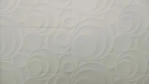 White 3D wall panel texture background with abstract circle pattern Foto stock