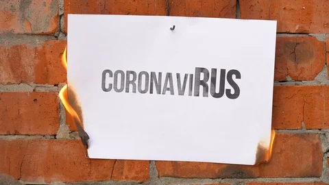 White A4 size paper with word coronaviRUS burns, smoke. Political war concept. Stock Footage 125637268