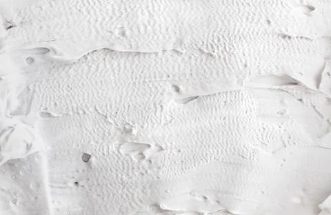 White abstract texture of surface with bold rough putty Foto stock