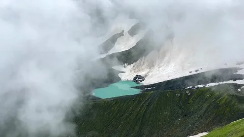 White Abudelauri Lake appears through thick cloud Stock Footage 340388033