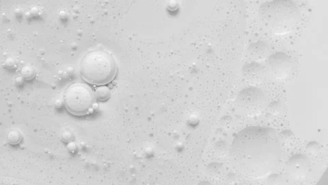 White acrylic paint bubbles abstract background 4k footage. Bubble is breakin Stock Footage 149110572