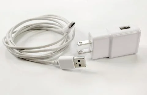 White adapter charging and wire Stock Photos