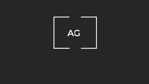 White advertising text emerging inside white frame, fragmenting against dark Stock Footage 307437145