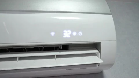 White air conditioner on white wall against background of interior of room Stock Footage 238780410