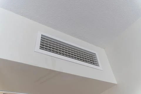 White Air Ventilation Grille in Interior Ceiling Wall Stock Photos