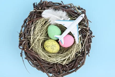 White airplane and easter egg nest flatlay Stock Photos