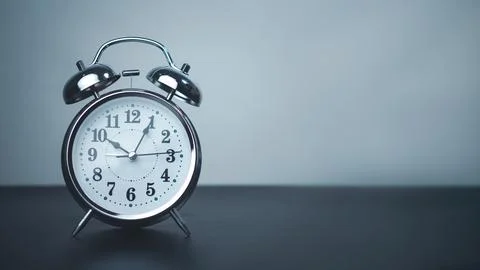 White alarm clock on black table with copy space for preparation of Merry C.. 스톡 사진