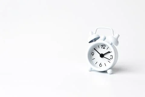 White alarm clock isolated on a white background Stock Photos