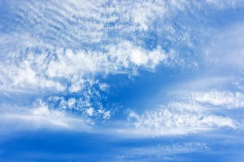 White altocumulus clouds pattern in blue sky on a sunny day, natural backgr.. Stock Photos