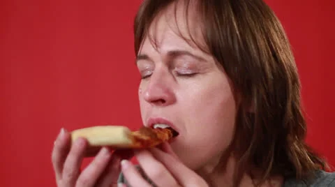 White American lady eats the pizza Stock Footage 22752974