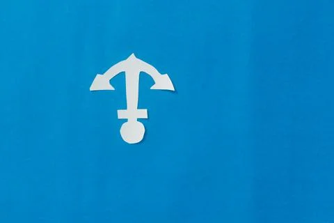 White Anchor on Isolated Blue background. Nautical theme. Copy Space. Foto stock