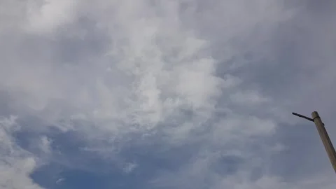 White and black cloud are flying Video stock 283349256