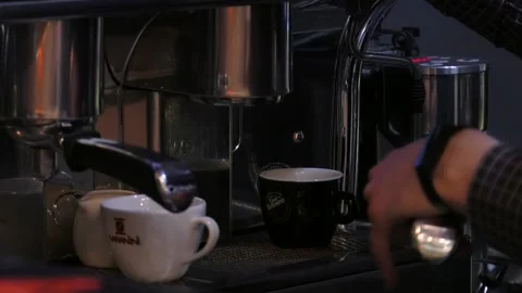 White and black cup are in the coffee machine. Video stock 122626987