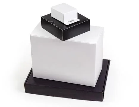 White and black rectangular cardboard packing boxes different sizes 스톡 사진