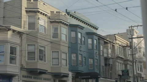 White and blue building windows with soft sunlight, San Francisco Stockbeeldmateriaal 333580671