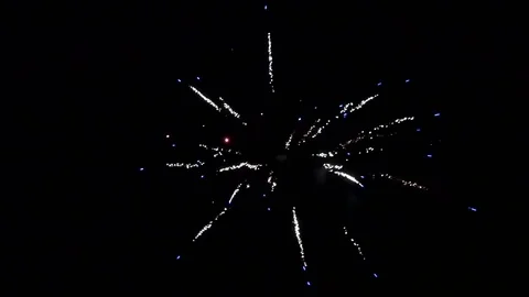 White and blue firework element on black background. Video stock 119010350