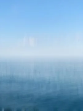 White and blue gradient background with blurred vertical motion. Background for Stock Photos