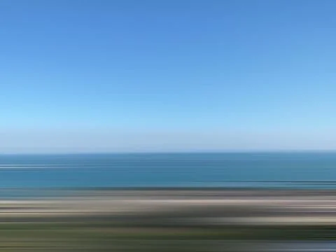 White and blue gradient background with blurred horizontal motion. Background Stock Photos