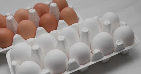White and brown chicken egg Stock Footage 130894065