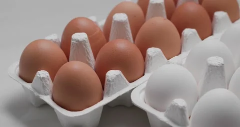 White and brown chicken egg in pack Stock Footage 132087625