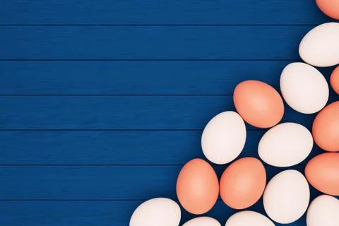 White and brown eggs lie on a blue wooden background, happy Easter, copy spac Stock Illustration