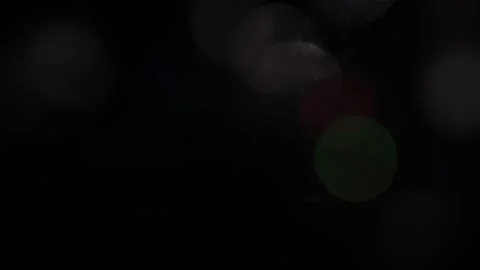 White and colored bokeh shining upwards in the black Video stock 318729985