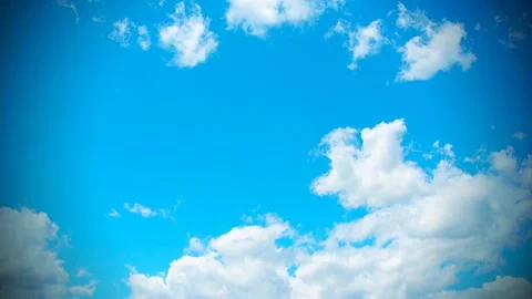 White and dark clouds fly rapidly across the blue sky. Time lapse atmosphere Stock Footage 211122484