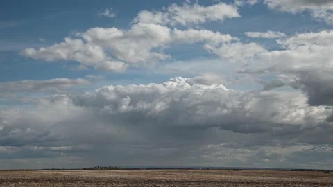 White and gray clouds are churning in an autumn sky Stock Footage 146386090