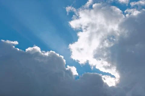 White and gray clouds on a blue sky Stock Photos
