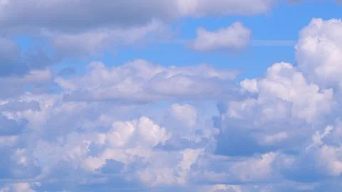 White and gray clouds fly across the sky and change shape. Clearing day and good 写真素材